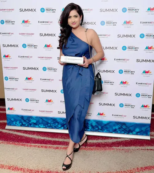Rachana Gupta – Founder and CEO of Oraanj Interiors Rachana Gupta, Founder and CEO of Oraanj Interiors, receiving an industry award, representing excellence in interior design leadership and innovation.