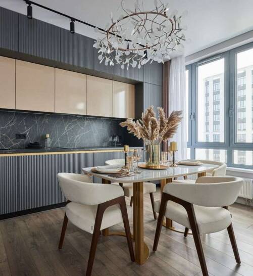 Modern Barbican Apartment Dining Room Interior Design Elegant dining room interior in a Barbican apartment featuring bespoke cabinetry, marble backsplash, designer chandelier and contemporary seating by Oraanj Interior Design.